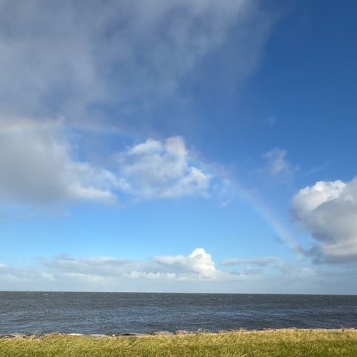 Regenbogen über dem Watt